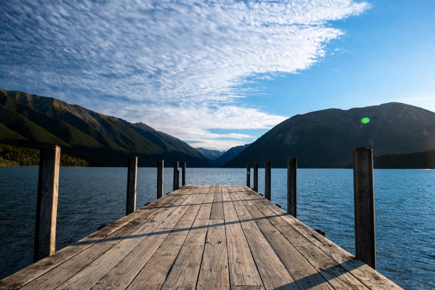 istock Tranquil Mountain Lake with Wooden Dock 2163057206