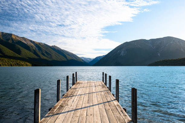 istock Tranquil Mountain Lake with Wooden Dock 2163057213