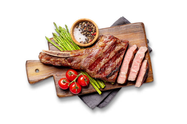 istock Medium rare grilled Tomahawk beef steak with asparagus 2163057546