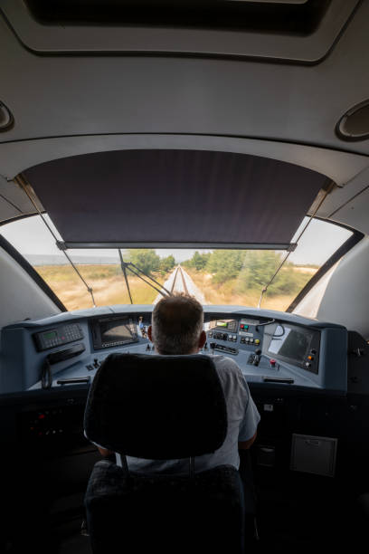 Locomotive engineer in the train control cabin