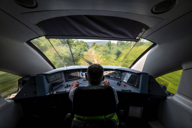 istock Locomotive engineer in the train control cabin 2163058730