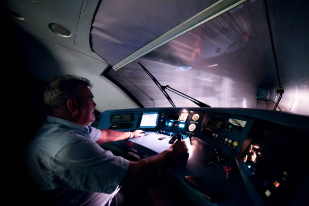 istock Locomotive engineer in the train control cabin 2163058736