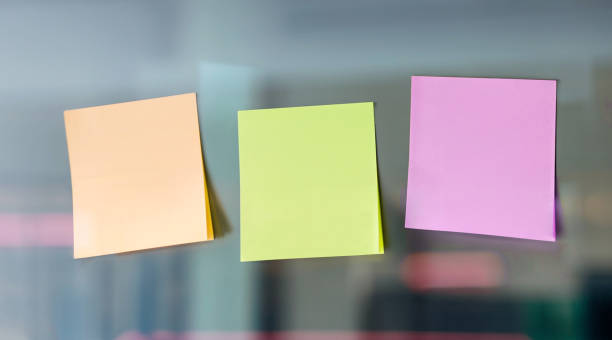 istock Empty sticky note papers on glass wall. Business planning concept. 2163064041