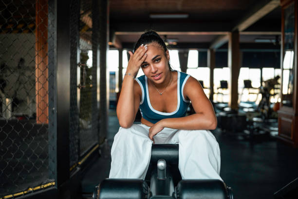 istock Young Hispanic Female Exercising In Gym With Determination 2163064199