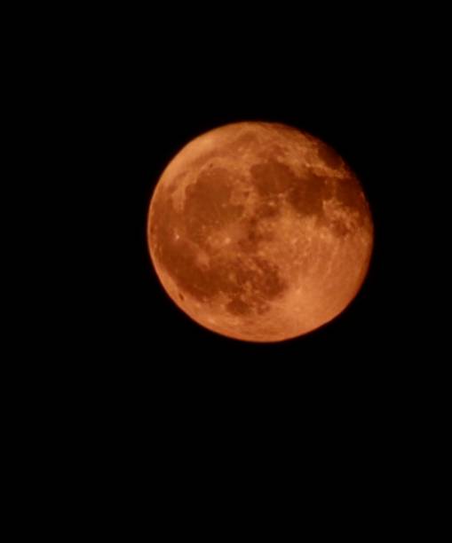 istock yellow full moon close up 2163064419