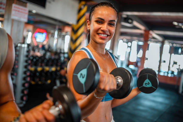 istock Hispanic Female Focused During Gym Workout. 2163064558