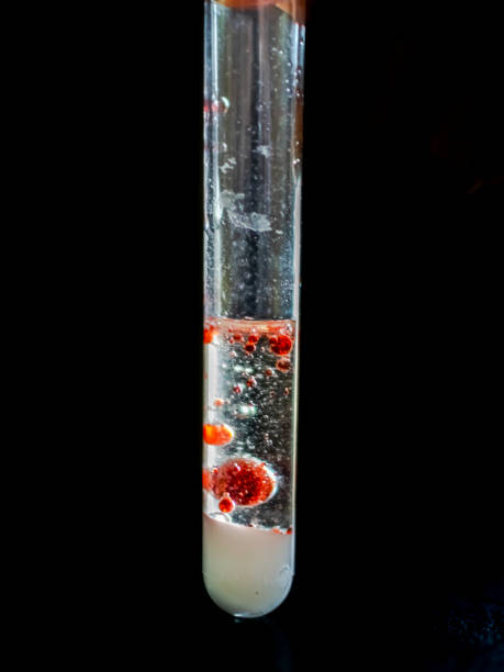 Laboratory Glass Tube and Water Splashes