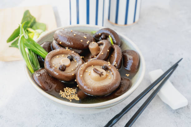 istock marinated shiitake. canned shiitake on a plate close-up 2163066109