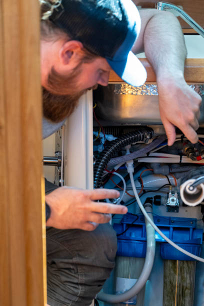 istock Man looks at sailboat engine 2163066615