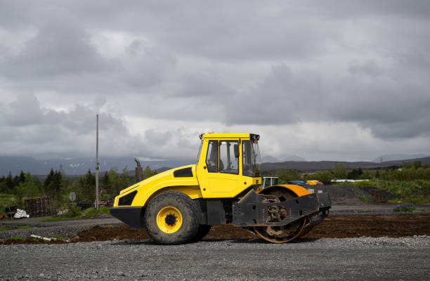 yellow asphalt roller is parked on the street in Reykjavik, Iceland, side view