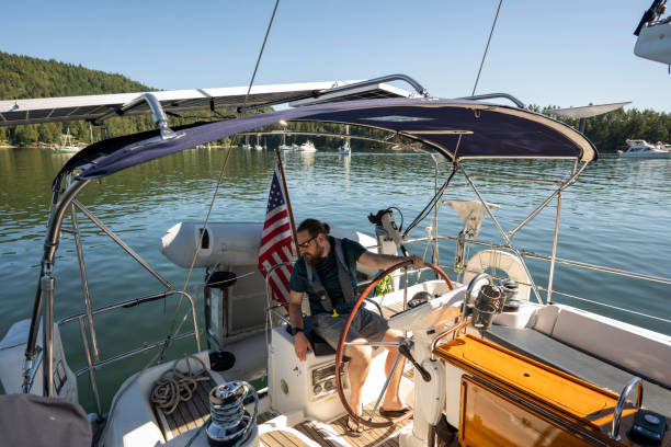 istock Portrait of captain steering boat 2163066683