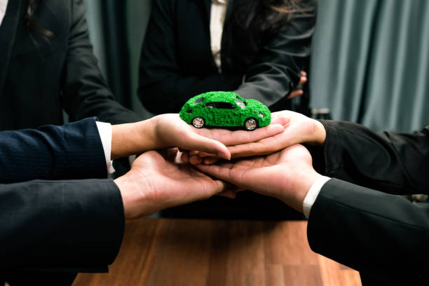 istock Business people synergy holding EV car model. Quaint 2163067985