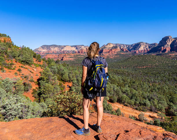 istock Female Hiker Overlooking The Secret Mountain Wilderness 2163069335