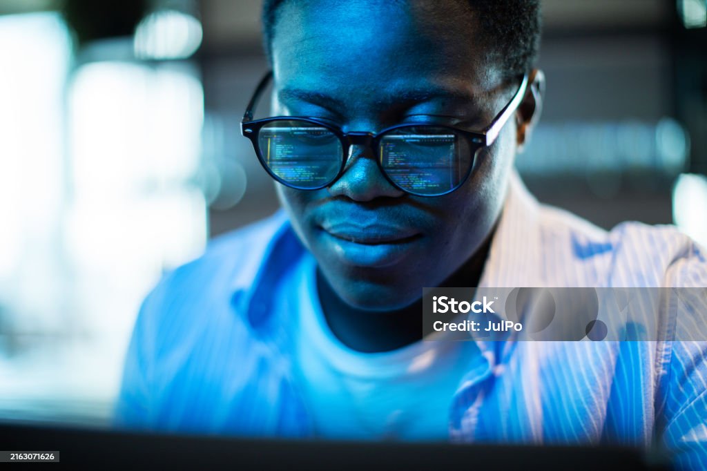 Young Adult Black Programmer Coding Using Laptop Stock Photo - Download ...