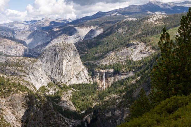 istock White granite stone Half Dome with waterfall and conifer trees in Yosemite national park in California, usa 2163073181