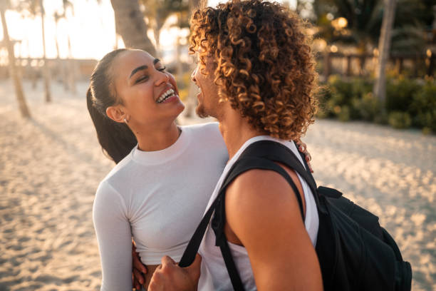 istock Energetic Hispanic Couple Relishing Beach Embrace Post Workout 2163073497