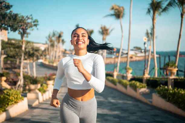 istock Hispanic Female Jogging Seaside 2163073897
