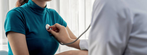 istock Doctor check patients's pulse with stethoscope in hospital. Rigid 2163074178