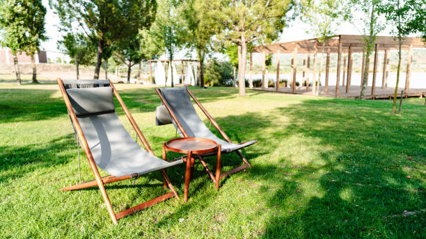 istock Outdoor lounge chairs on grass 2163074201