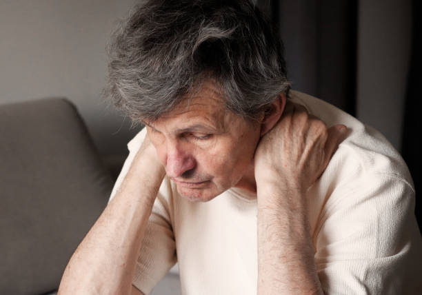 istock An elderly man massages his tired shoulder at home after doing housework. Prevention of osteoarthritis 2163076360