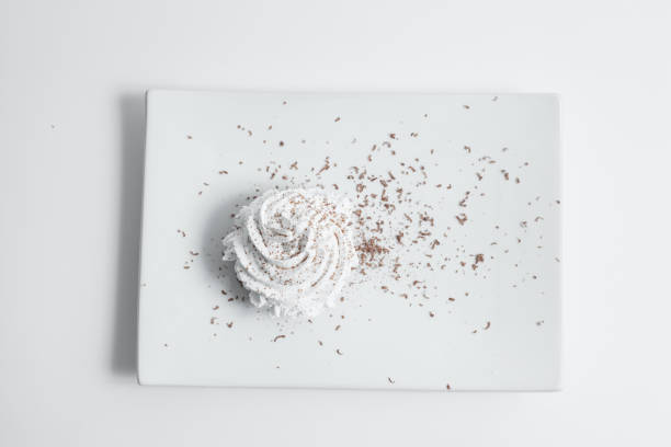 top view sweet cake decorated frosting and grated chocolate