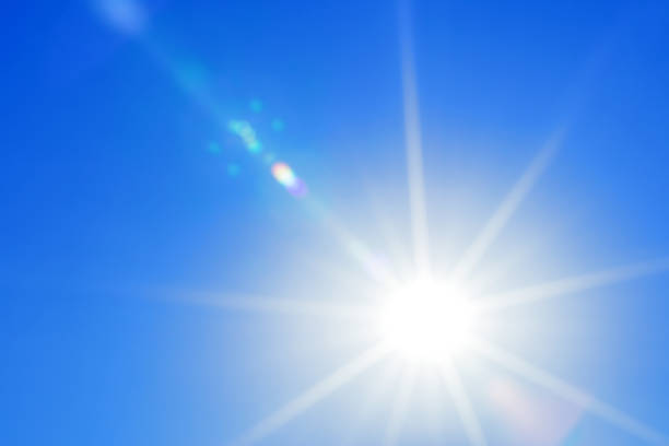 istock Bright sun with beautiful beams in a blue sky 2163079169