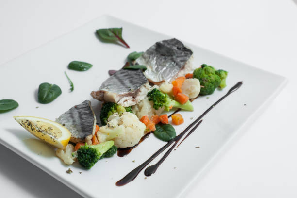 healthy sea food with lemon, basil, cauliflower and carrots