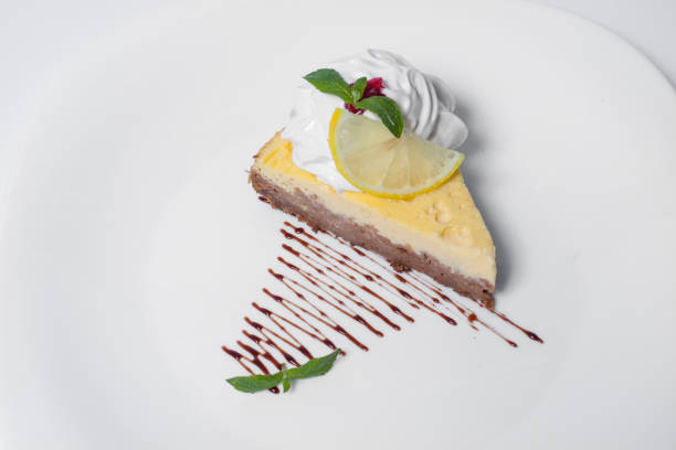 tasty cheesecake with cream and mint leaf isolated. High quality photo