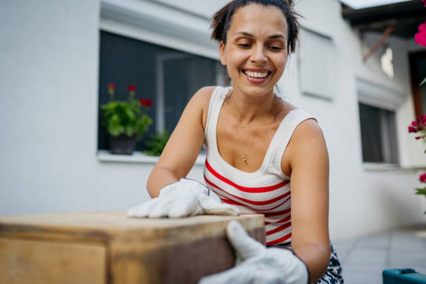 istock Women sanding old furniture 2163081633