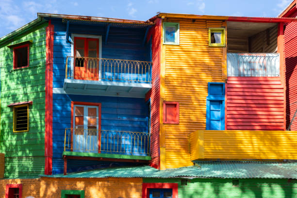 Row of colourful houses on a street at twilight