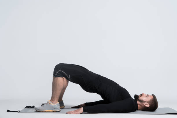 istock sporty man doing stretching exercise and workout on yoga mat on white background 2163083237