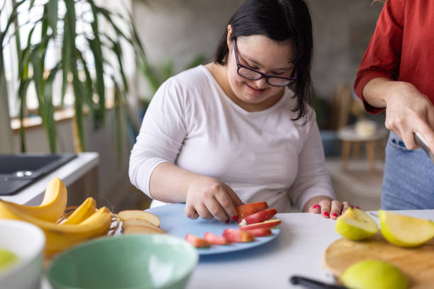 istock Young woman making a fruit salad 2163087675