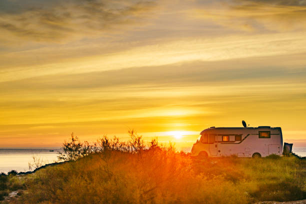 istock Caravan on sea at sunrise. 2163087700