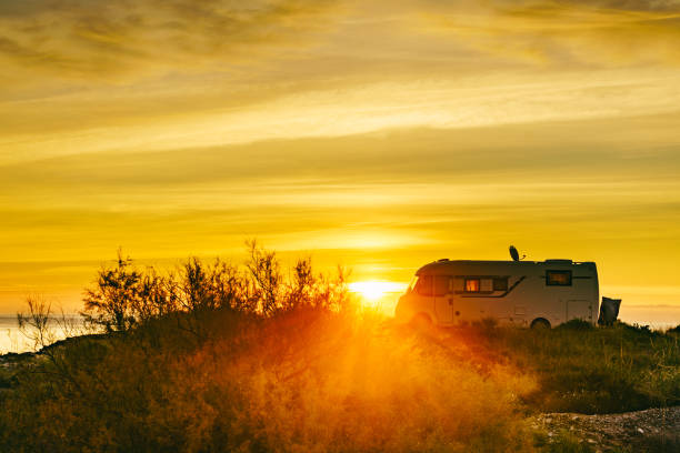 istock Caravan on sea at sunrise. 2163087763