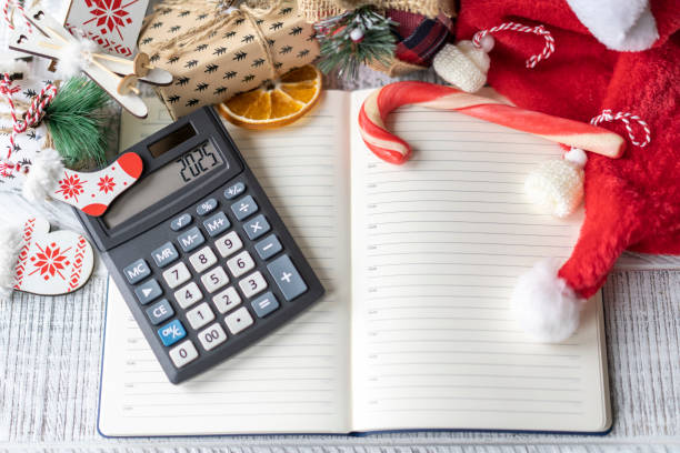 istock New Year's layout with calculator, Santa's hat and Christmas decorations 2163088752