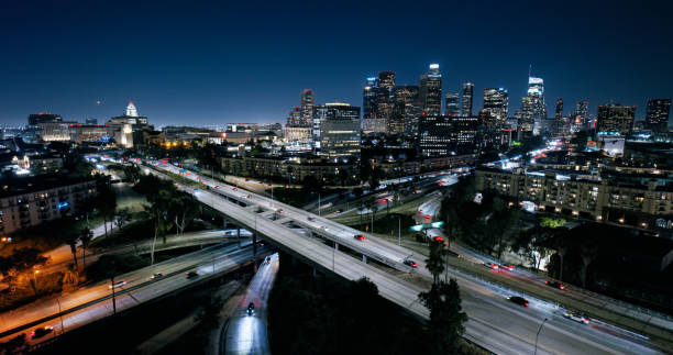 istock High Angle Aerial View of DTLA on a Clear Night with Highway System underneath 2163097633