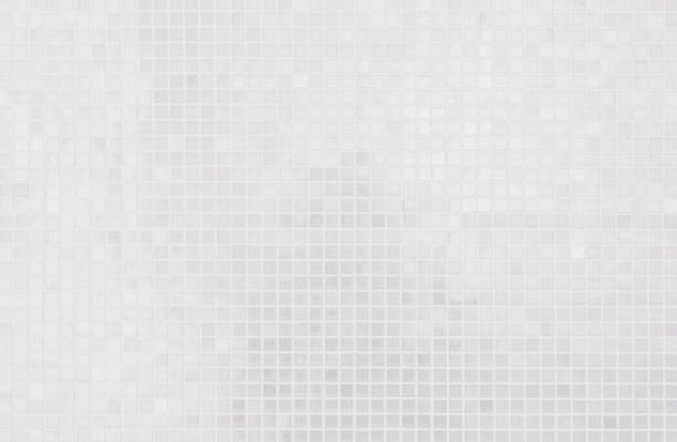 istock White tile wall chequered background bathroom texture. Ceramic brick wall and floor tiles mosaic background in bathroom and kitchen clean. Design pattern geometric with grid wallpaper decoration. 2163098237