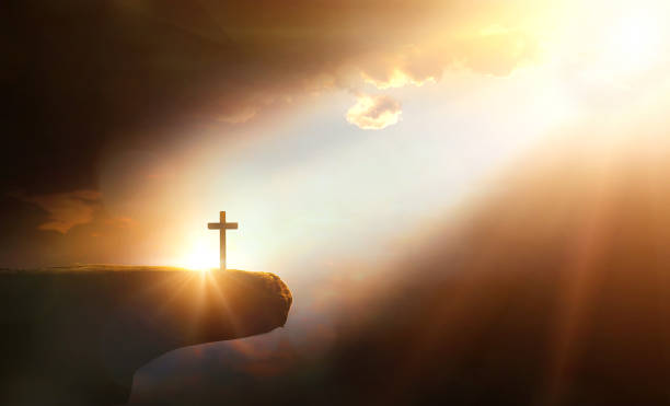 istock Cross on the cliff with sunlight and clouds. 3d illustration. 2163109741