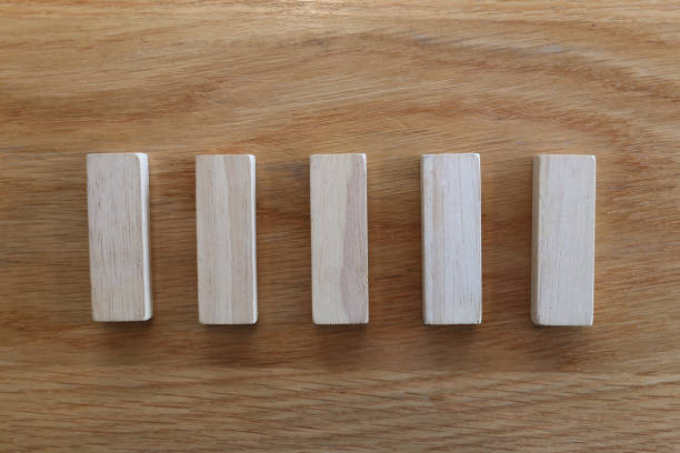 istock Five wooden puzzles arranged in a row. 2163113379