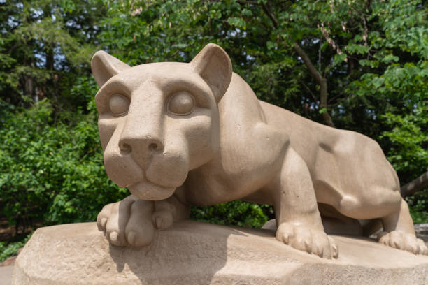 University Park, Pennsylvania-July 21,2024: Nittany Lion Shrine on the campus of Penn State in State College. The Nittany Lion is a favorite photo location for students and alumni.