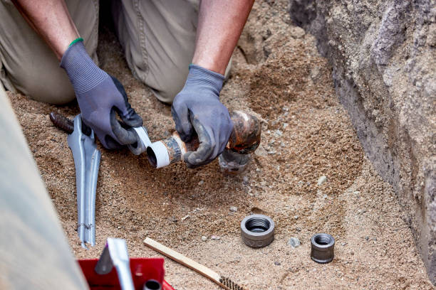 istock A Plumber hooking up a temporary gas line to a propane tank 2163116129
