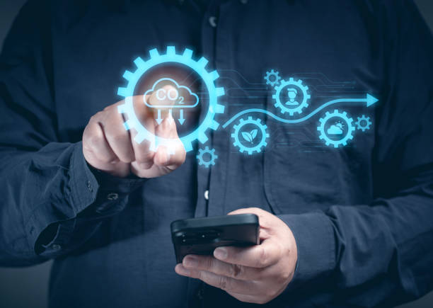 istock A man uses a mobile phone to order tasks to check carbon climate sustainable on the virtual screen. Eco earth environment and pollution change. Global economy renewable strategy in future. 2163118087