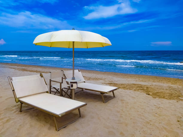 istock the sunbeds and parasols on the beach 2163130049