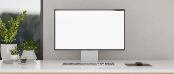 istock A minimalist white home office or private office featuring a computer mockup on a white desk. 2163131502