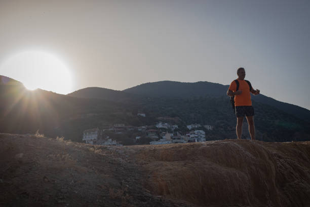 A man on a rock from which water springs, a natural phenomenon
