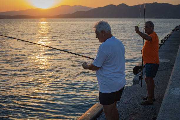 Two men are fishing with a hook