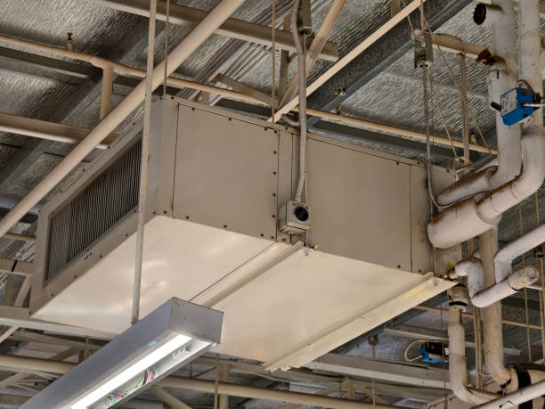 istock Ceiling with ventilation pipes and lights in industrial building 2163138820