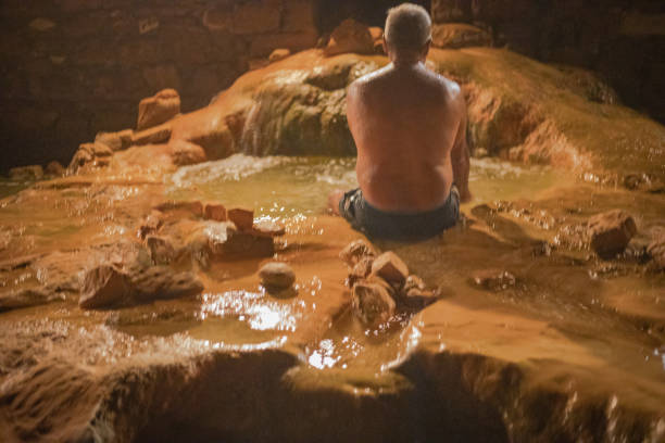 Elderly man in warm water, spa resort