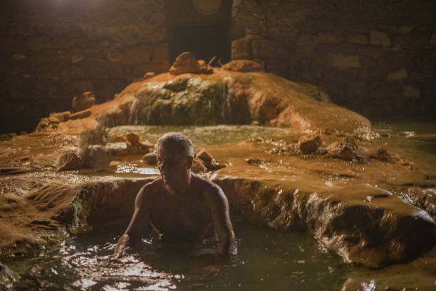 Elderly man in warm water, spa resort