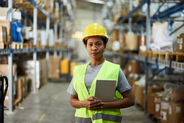 istock Black female worker working in distribution warehouse. 2163142324